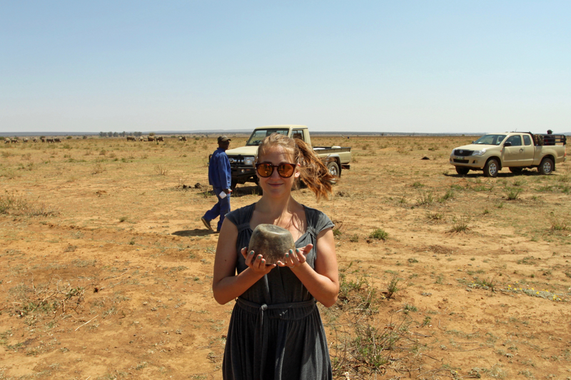 The author holding a freshly-cut piece of rhino horn at a rhino ranch in South Africa.